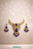 Gold necklace with purple stones and matching earrings